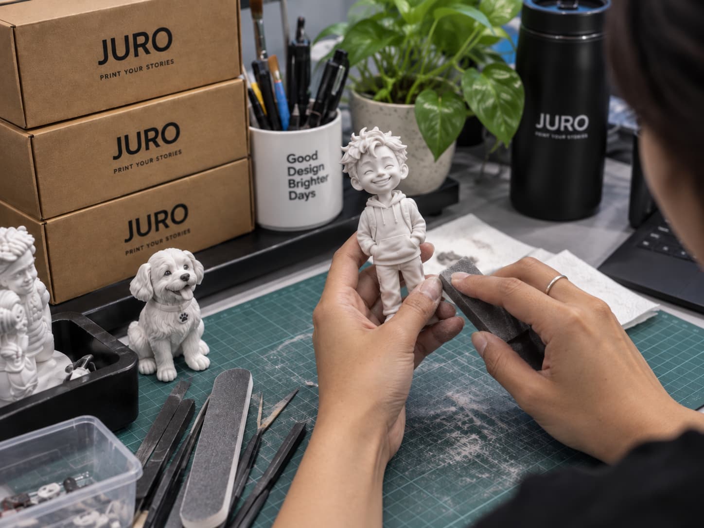 A JURO figure being inspected and carefully finished by hand