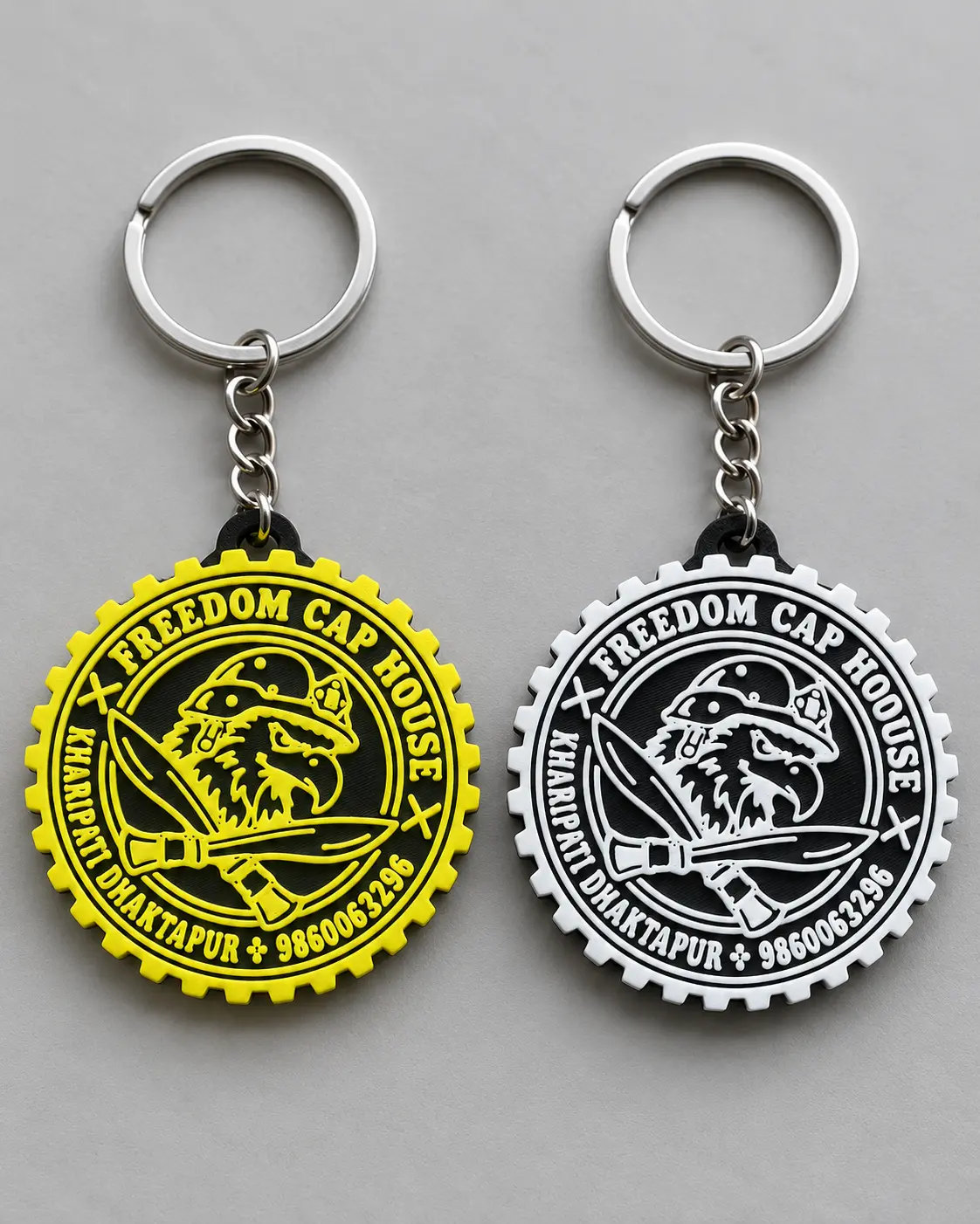 Yellow and black Freedom Car House logo keyrings